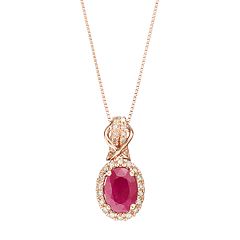 10k Rose Gold Ruby & 1/6 Carat T.W. Diamond Halo Pendant Necklace by