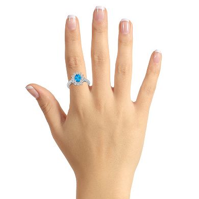 Alyson Layne 14k White Gold Oval Cut Blue Topaz & 7/8 Carat T.W. Diamond Halo Ring