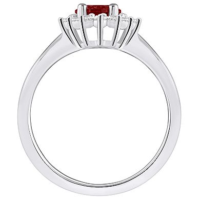 Alyson Layne 14k White Gold Garnet & 1/4 Carat T.W. Diamond Halo Ring
