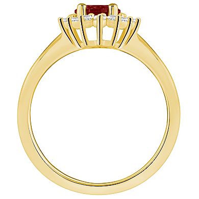 Alyson Layne 14k Gold Garnet & 1/4 Carat T.W. Diamond Halo Ring