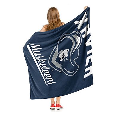 The Northwest Xavier Musketeers Alumni Silk-Touch Throw Blanket