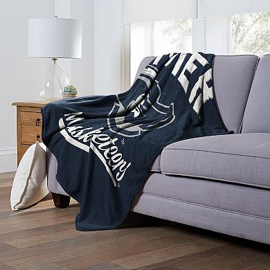 The Northwest Xavier Musketeers Alumni Silk-Touch Throw Blanket