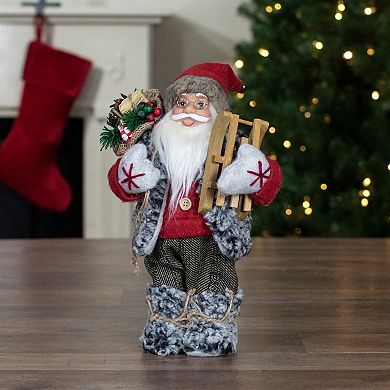 12" Standing Santa Christmas Figure Carrying Presents and a Sled