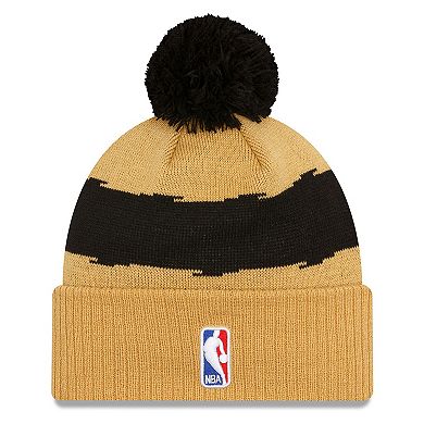 Men's New Era  Gold Toronto Raptors 2023/24 City Edition Cuffed Pom Knit Hat