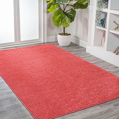 Haze Solid Low Pile Area Rug Red