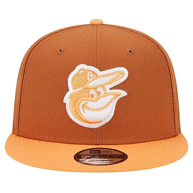 Men's New Era Brown Baltimore Orioles Spring Color Two-Tone 9FIFTY Snapback Hat
