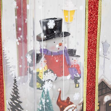 Northlight 12" Lighted and Musical Snowman Family Snowing Gift Box Christmas Decoration