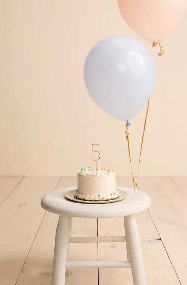 birthday balloon and children wearing Little Co pastels