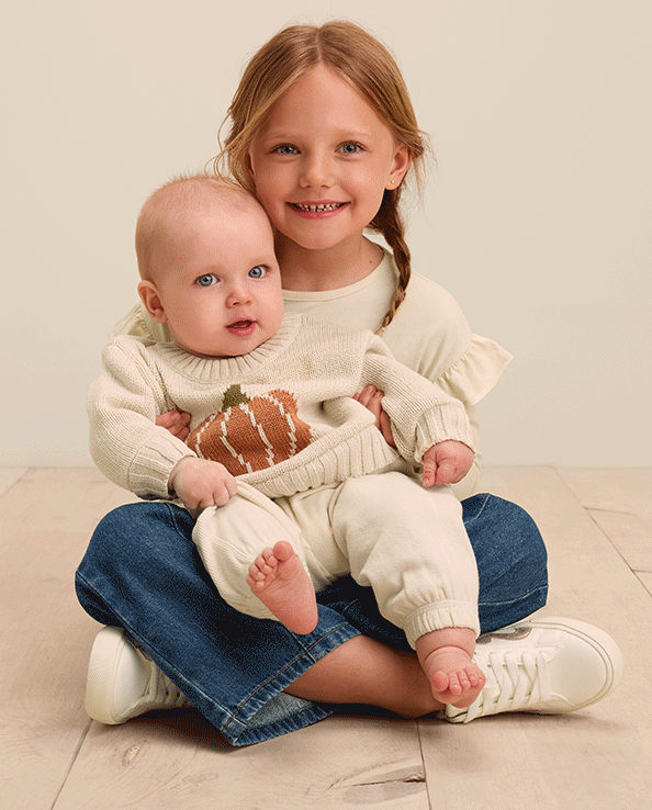 Fall collection of cozy kids sweaters, pajamas, and shirts with decrative fall patterns and images