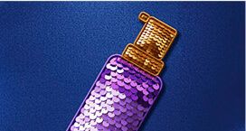 Image of a purple sequinned spray bottle