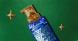 Image of a blue sequinned spray bottle