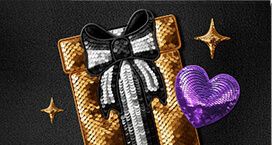 Image of a gold sequinned giftbox with a purple sequinned heart laid on top
