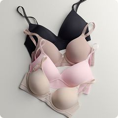 a pile of different colored bras