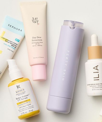 Collection of travel-sized skincare and makeup products.