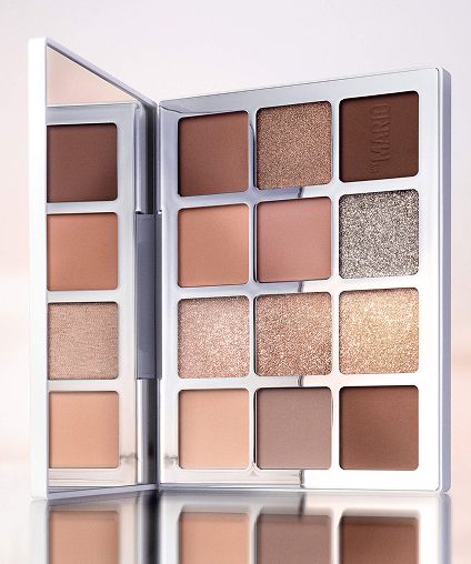 Eyeshadow pallette over a mirrored surface.