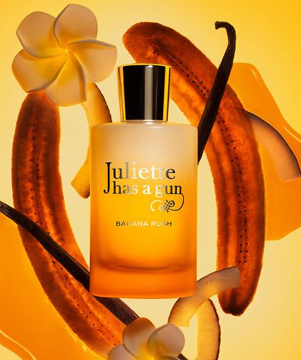 Juliette has a gun Banan Rush container in front of bananas.