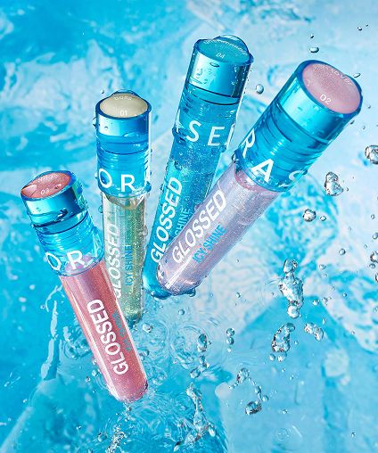 Four blue Sephora lip gloss tubes.