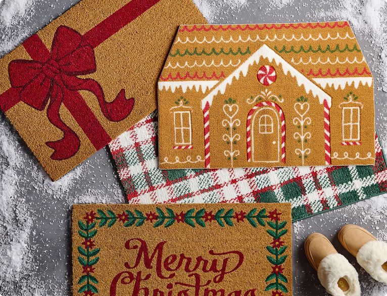 Gingerbread house and gift-themed Christmas doormats.