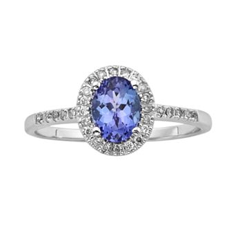 The Regal Collection 14k White Gold Genuine Tanzanite and 1/7 ct T.W. Diamond Halo Ring