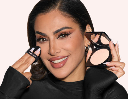 Image of model applying powder makeup