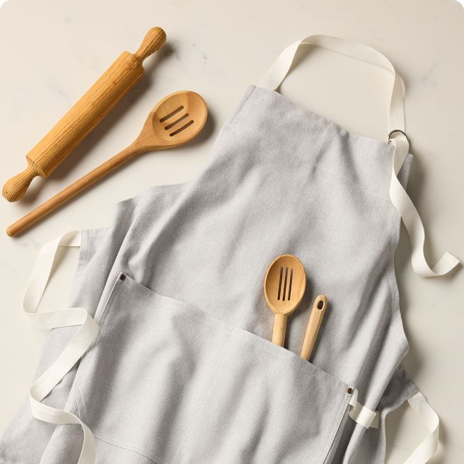 Various baking tools laid out on an apron