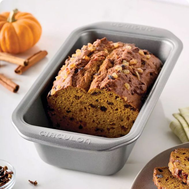 Bread pan filled with half loaf of bread