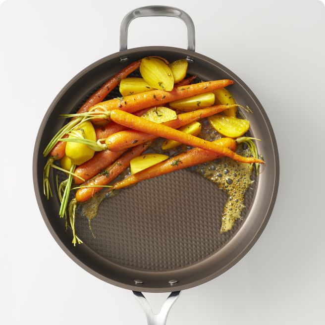 Frying Pan filled with carrots and potatoes