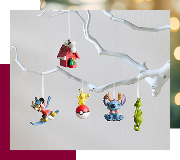 white tree branch with ornaments hanging from it