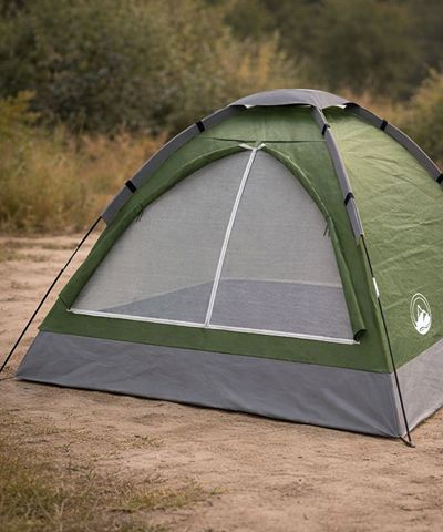 Green and gray tent pitched in the outdoors.