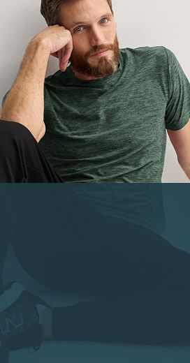 man wearing green shirt black pants