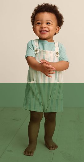 toddler wearing a light blue shirt and white suspender pants with blue lines