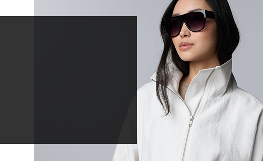 woman wearing a white zip up jacket and sunglasses