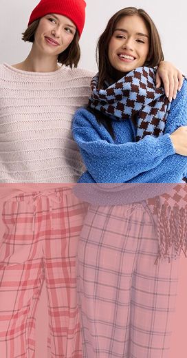a couple of young women wearing so brand winter clothing