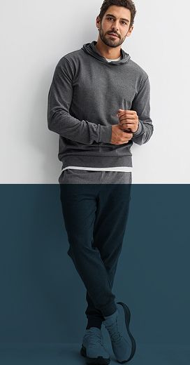 man wearing green shirt black pants