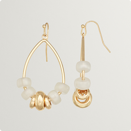 Two gold earrings - one from the front and the other from the side view.
