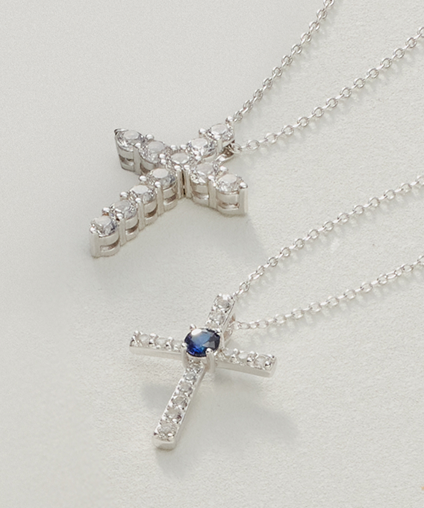 Two necklaces with cross shaped pendants.