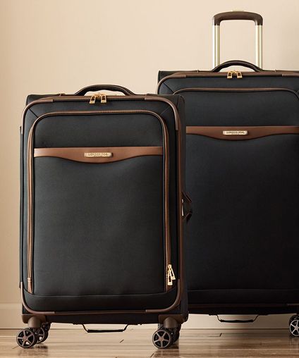Two peices of London Fog luggage - black with brown trim.