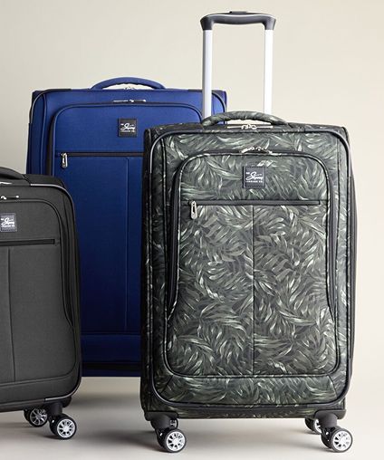 Three Skyway luggage bags - black, blue, and a dark patterned piece.