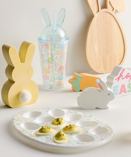 Bunny and Easter themed decorations and serveware arranged in display.