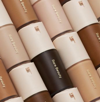 6 rows of Rare Beauty foundation containers stacked on top of eachother.