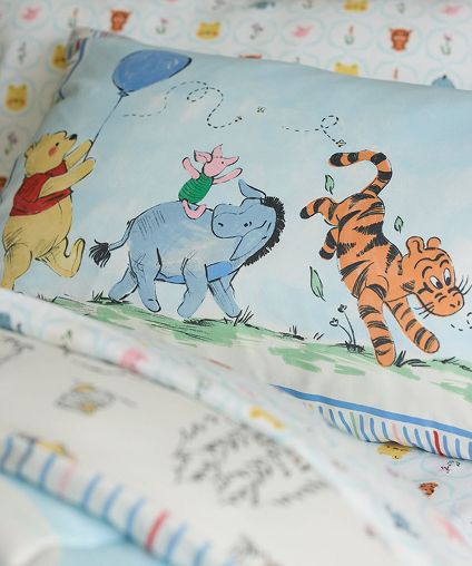 Winnie The Pooh themed bedding.