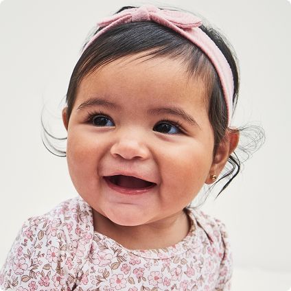 Baby girl wearing pink floral top