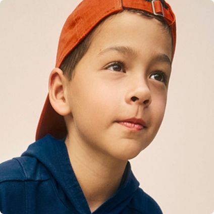 Boy wearing orange cap and hoodie