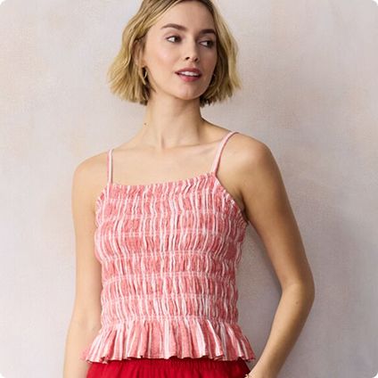 Woman wearing pink smocked peplum top