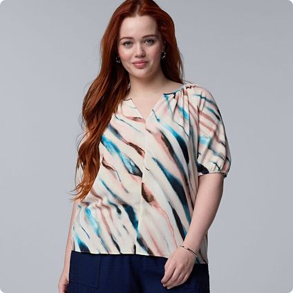 Woman wearing colorful abstract print top