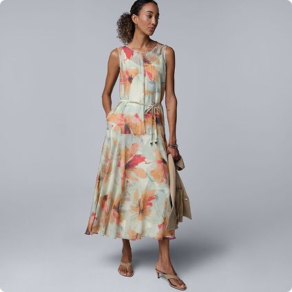 Woman wearing floral print sleeveless dress
