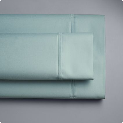 Stack of folded light blue sheets