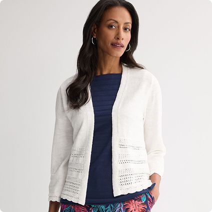 Woman wearing white open-front cardigan