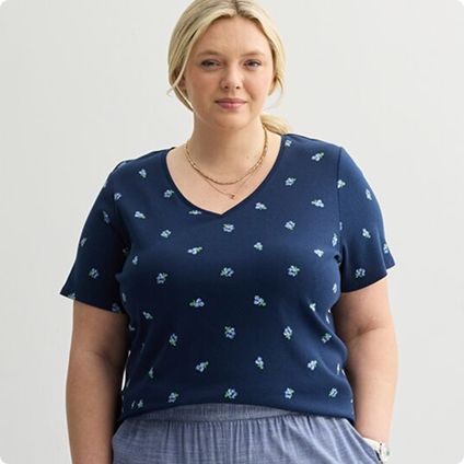 Woman in navy blue patterned t-shirt