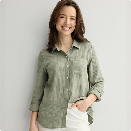Woman wearing olive green button-down shirt